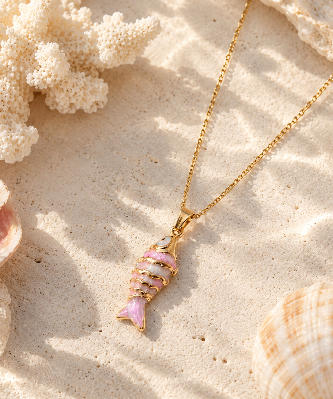 Pink fish pendant necklace with gold-tone detailing
